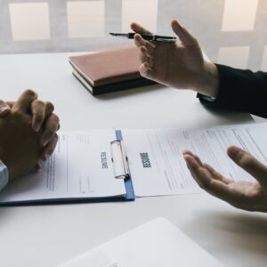 Job applicants are holding a resume document in the job interview room, job interview concept.